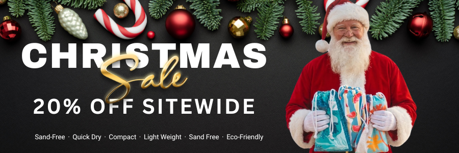 Promotional banner for a Christmas sale with Santa Claus holding a product and festive decorations.